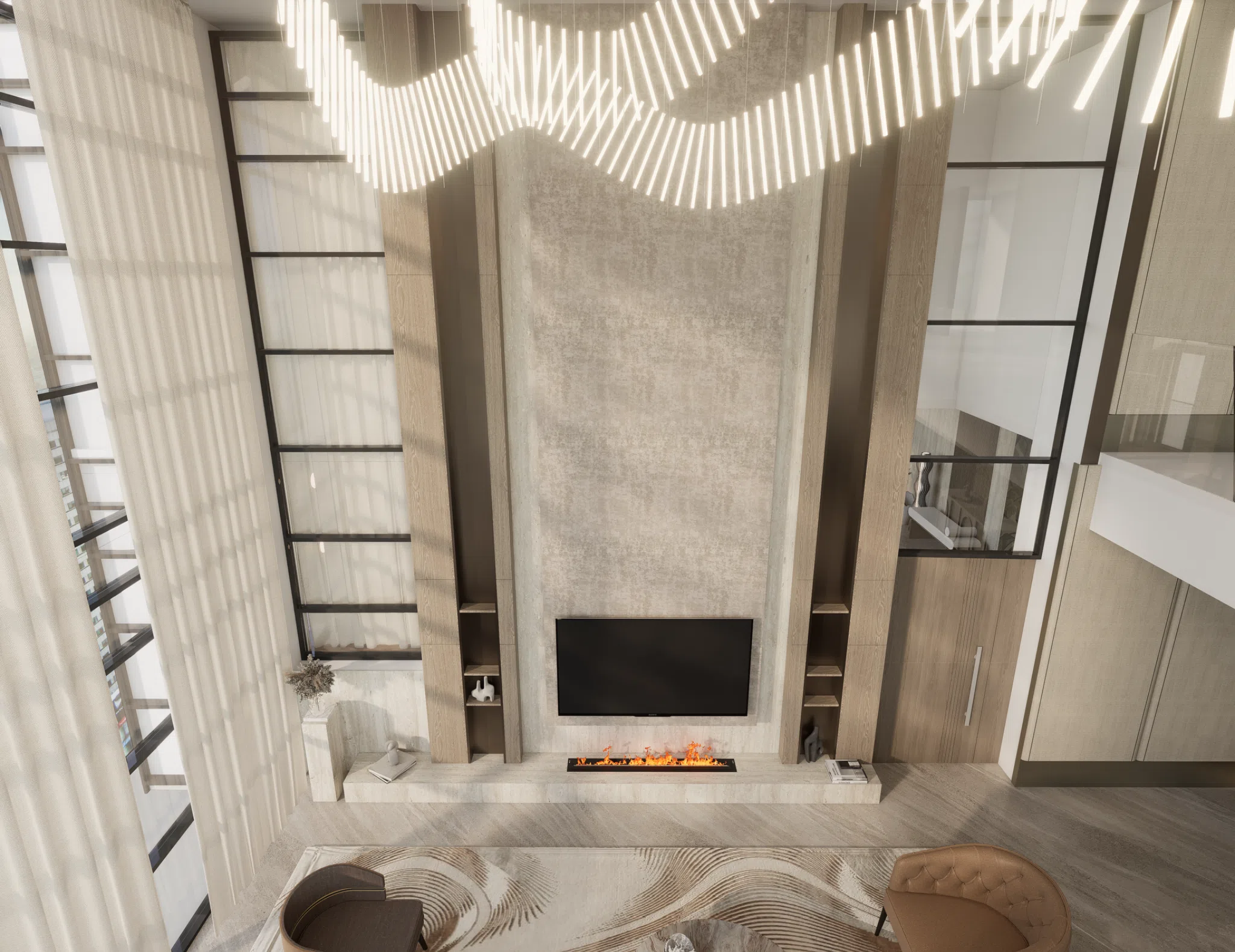 Double-height feature wall and chandelier viewed from above